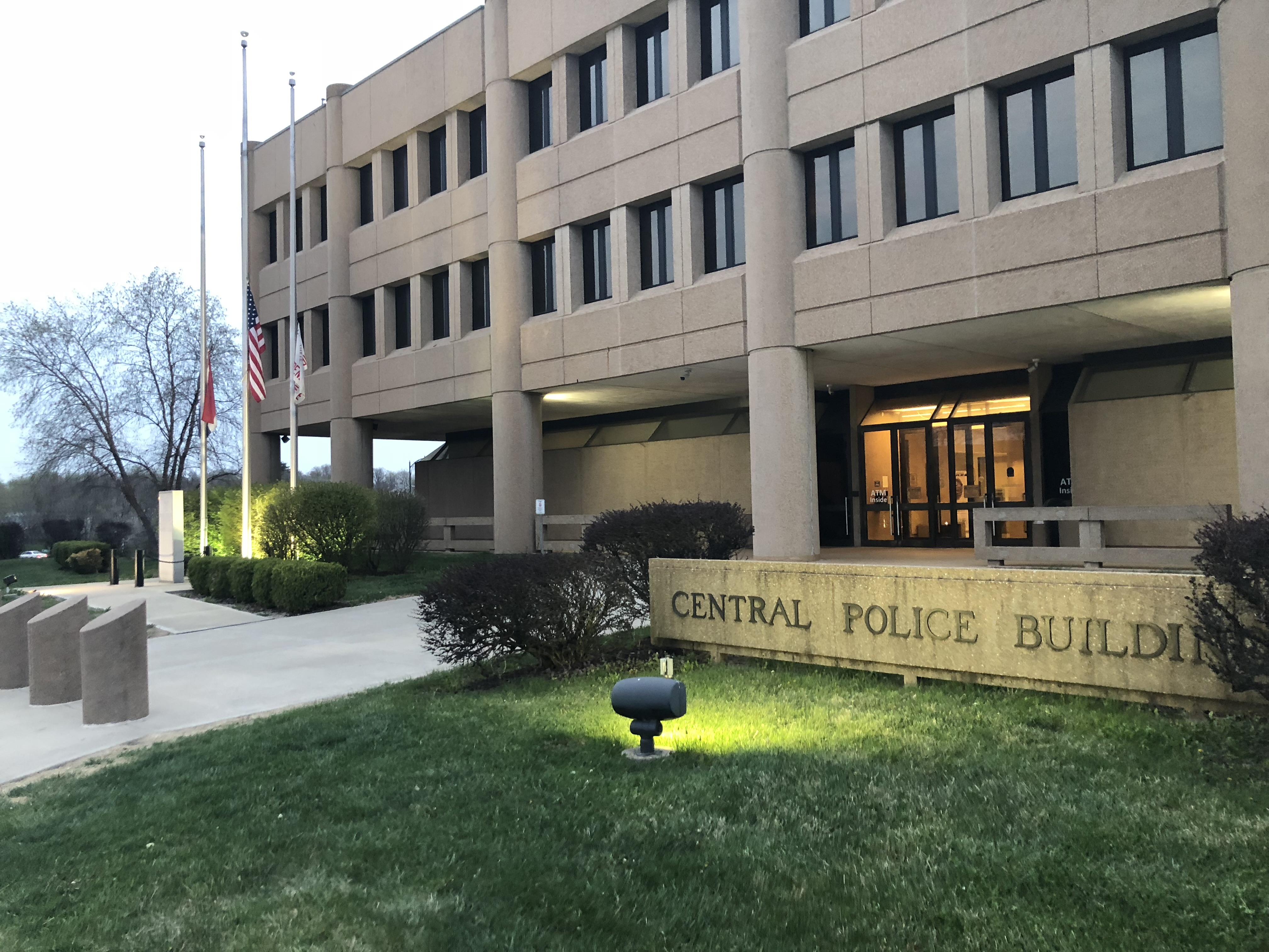 Lights shine on the front of the Central Police Building also known as Independence Police Headquarters in the early morning hours.