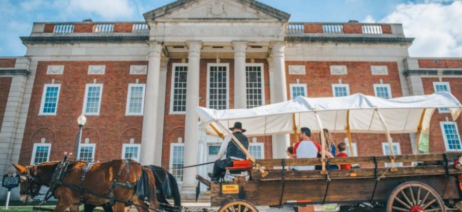 Pioneer Aventure Trails wagon next to Historic Truman Courthouse