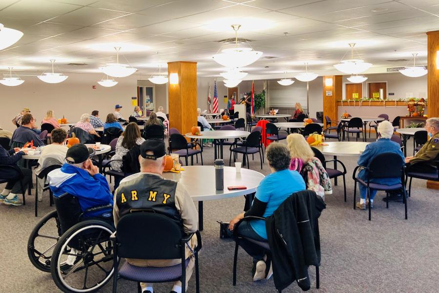 A picture of people gathered in the Palmer Center Dining Room for a Veteran's Recognition event