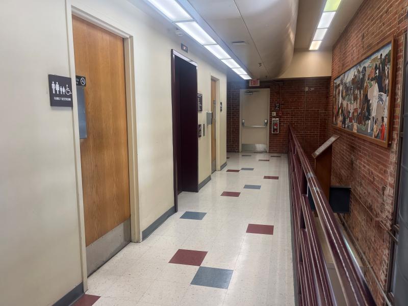 An image of the hallway at the Sermon Center outside of the South Meeting Room with two family restrooms and an elevator.