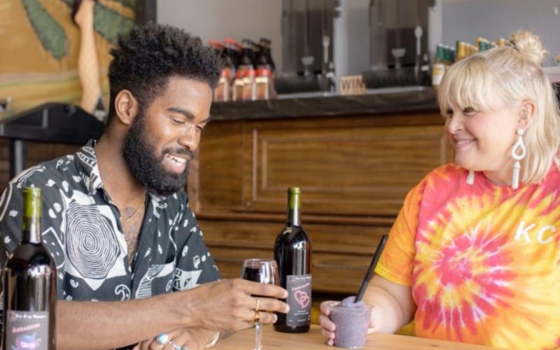 Image of Couple with wine at Top Hat Winery