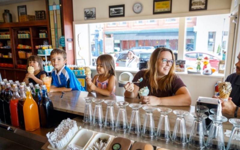 Image of family enjoying drinks at Clinton's Soda Fountain