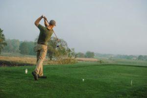 A golfer tees off while at the Drumm Farm Golf Course