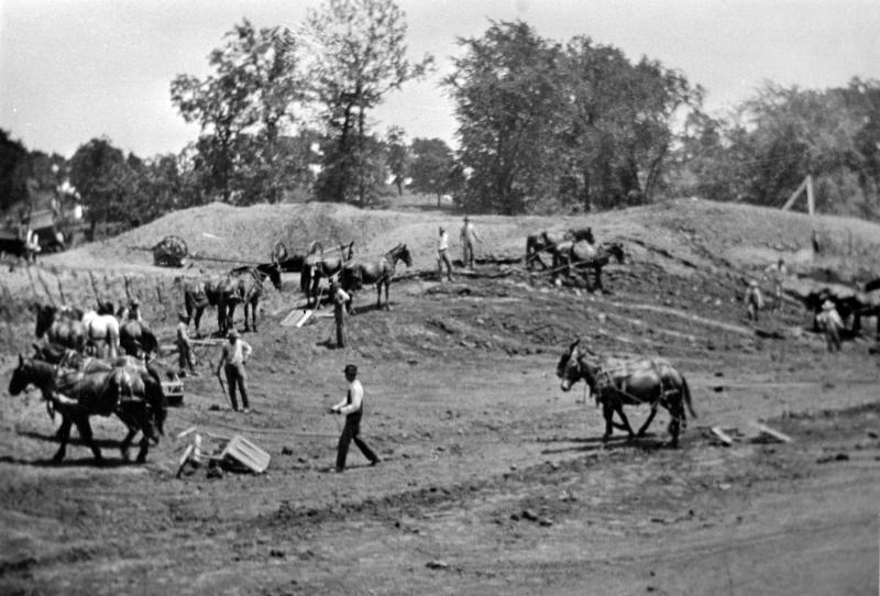 Historical photo of men and teams of horses