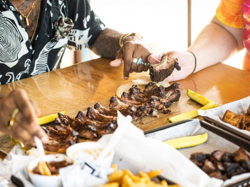 Couple enjoying ribs after a Chief's game. 