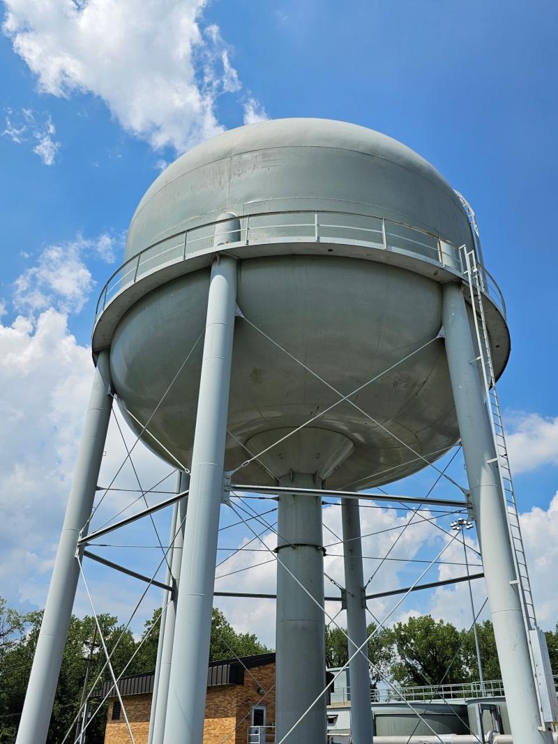 water tower with clouds