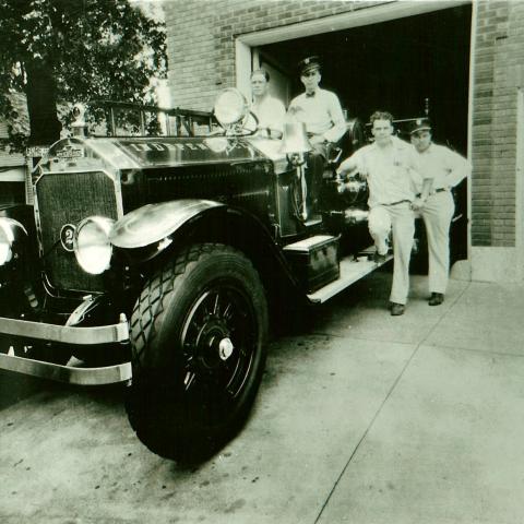 Firefighters with La France Pumper